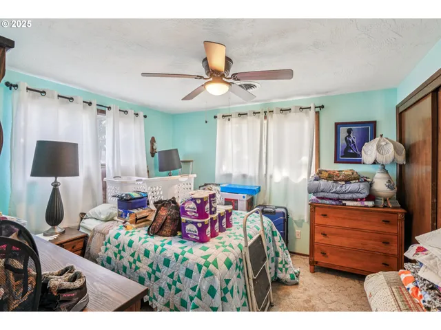a bedroom with furniture and a window