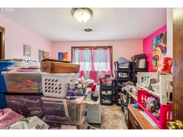 a bedroom with furniture and a book shelf