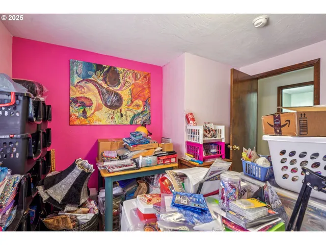 a bed room with lots of furniture and books