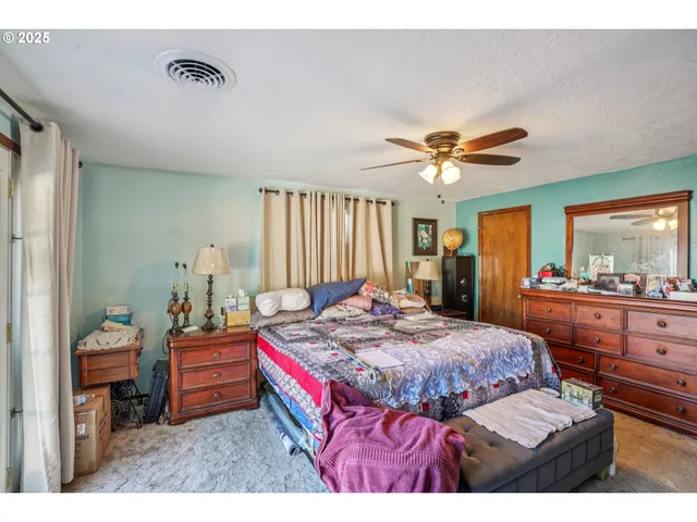 a bed room with a bed and a window