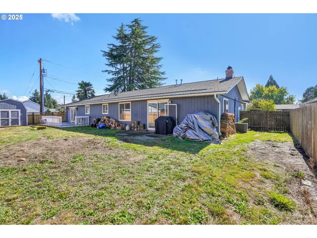 a view of a house with backyard porch and furniture