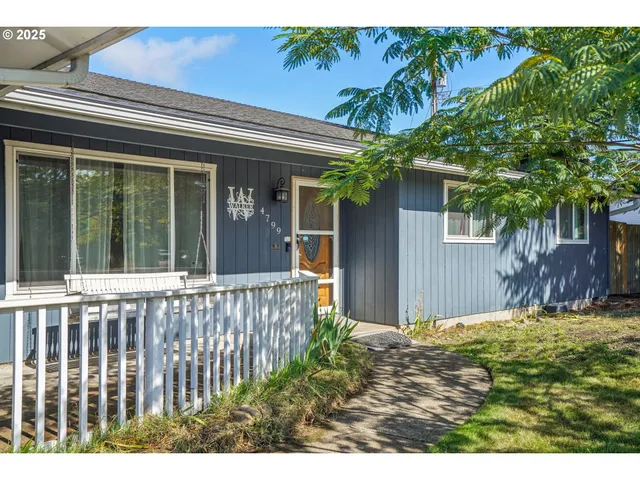 a view of a house with a small yard