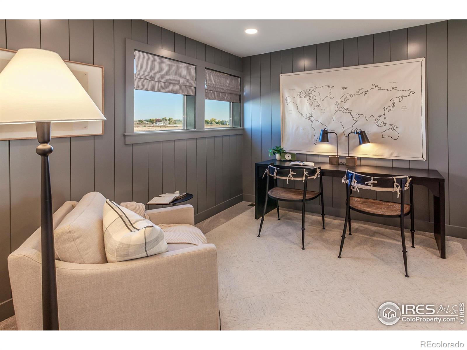 6079 Red Barn Road Fort Collins, CO 80528 - Photo 20 of 41 a living room with furniture and a wall painting