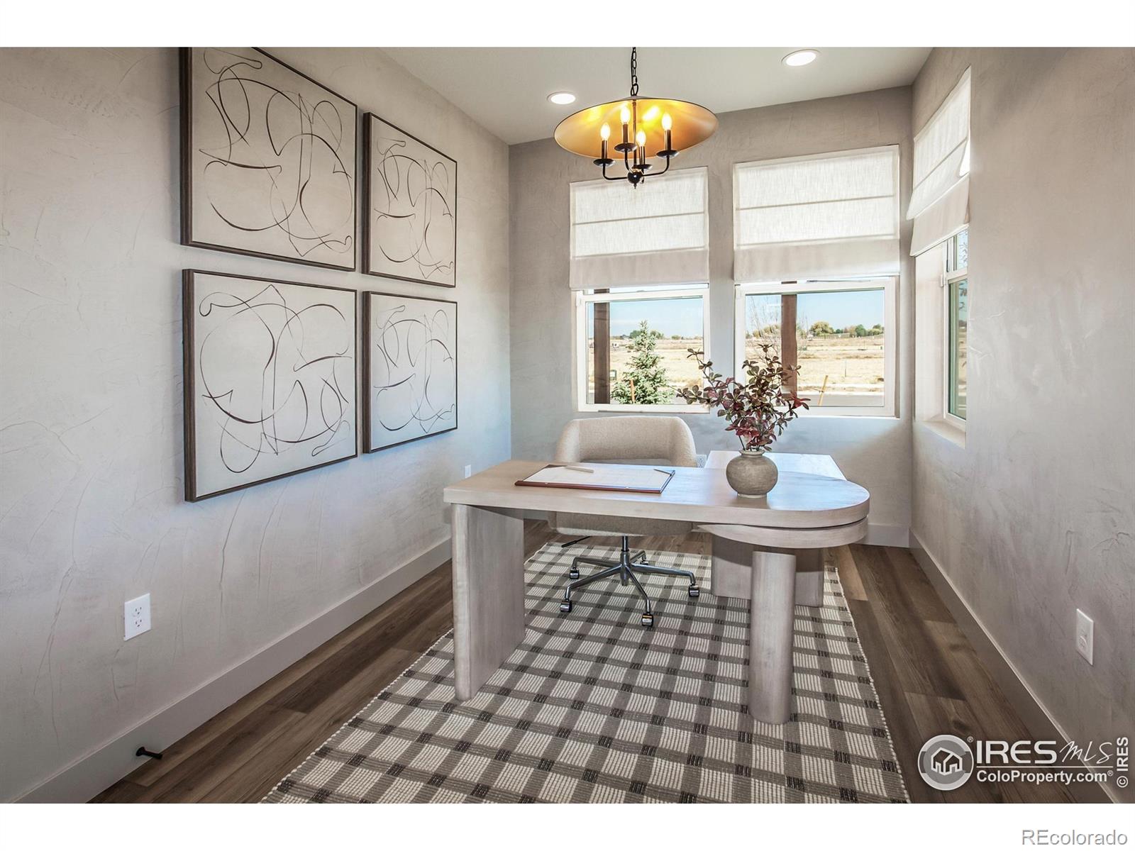 6079 Red Barn Road Fort Collins, CO 80528 - Photo 3 of 41 a dining room with wooden floor and a chandelier