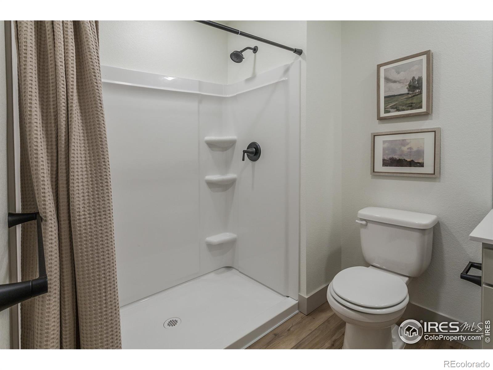 6079 Red Barn Road Fort Collins, CO 80528 - Photo 35 of 41 a bathroom with a toilet and a shower