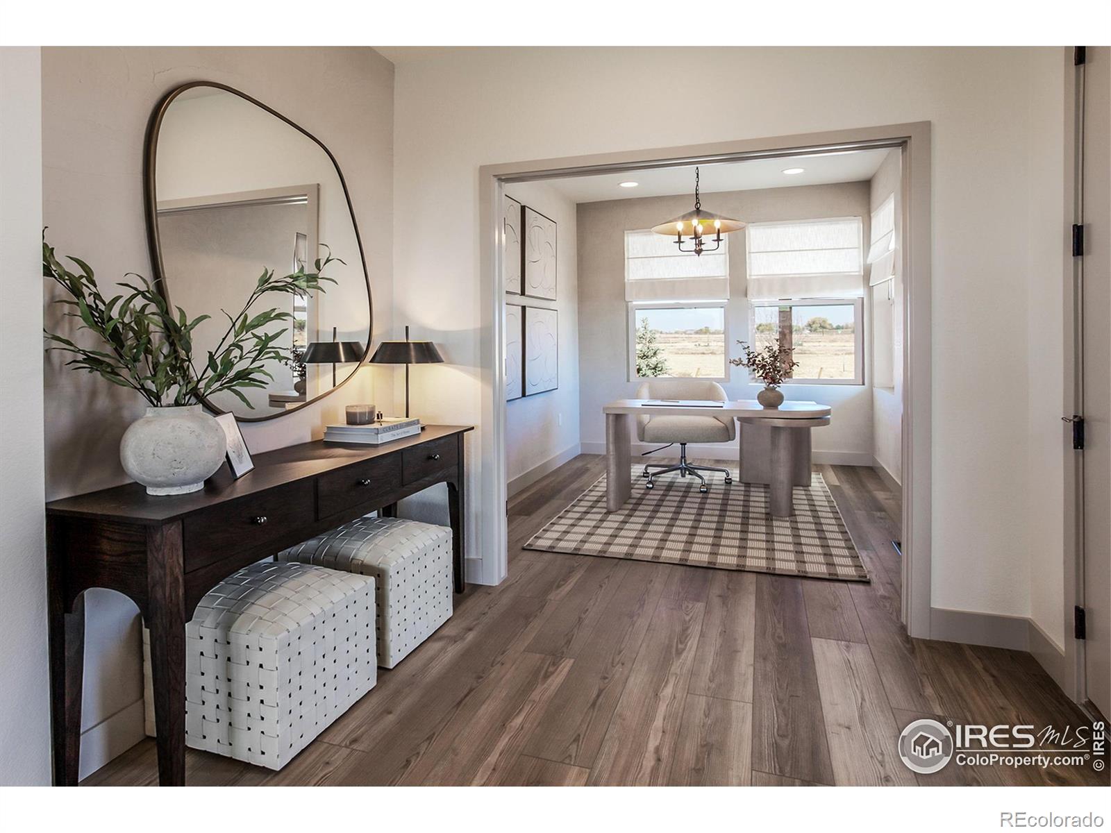 6079 Red Barn Road Fort Collins, CO 80528 - Photo 4 of 41 a living room with furniture and a wooden floor