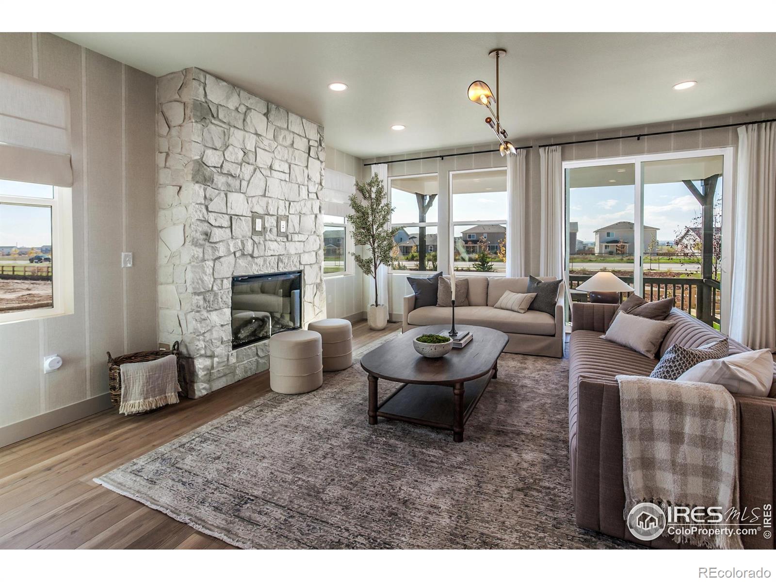 6079 Red Barn Road Fort Collins, CO 80528 - Photo 6 of 41 a living room with furniture and a fireplace