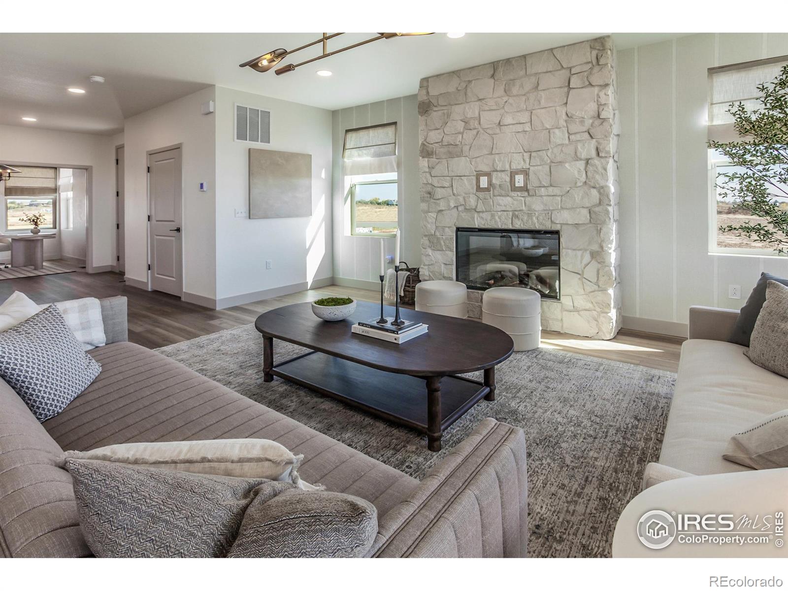 6079 Red Barn Road Fort Collins, CO 80528 - Photo 7 of 41 a living room with furniture and a fireplace