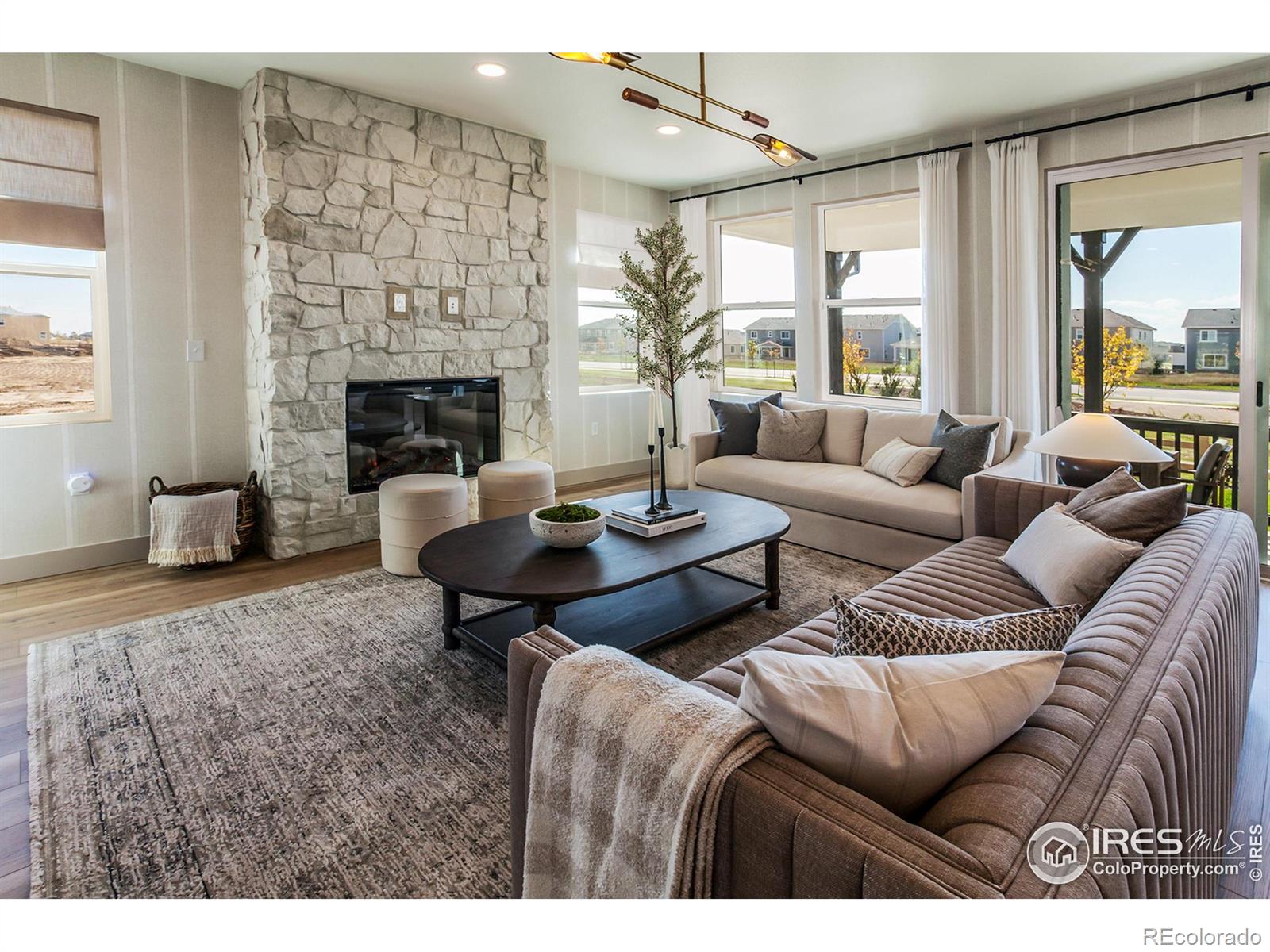 6079 Red Barn Road Fort Collins, CO 80528 - Photo 8 of 41 a living room with furniture and a fireplace