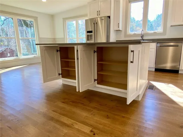 an empty room with closet and a bathroom
