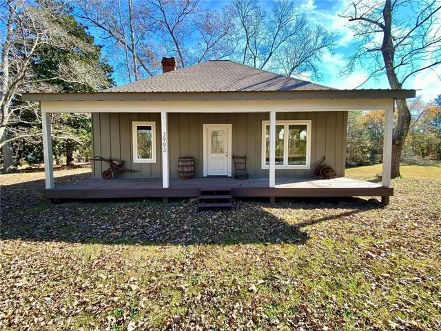 a view of workspace with wooden floor and windows