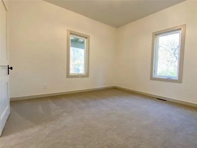 a view of an empty room with a garage