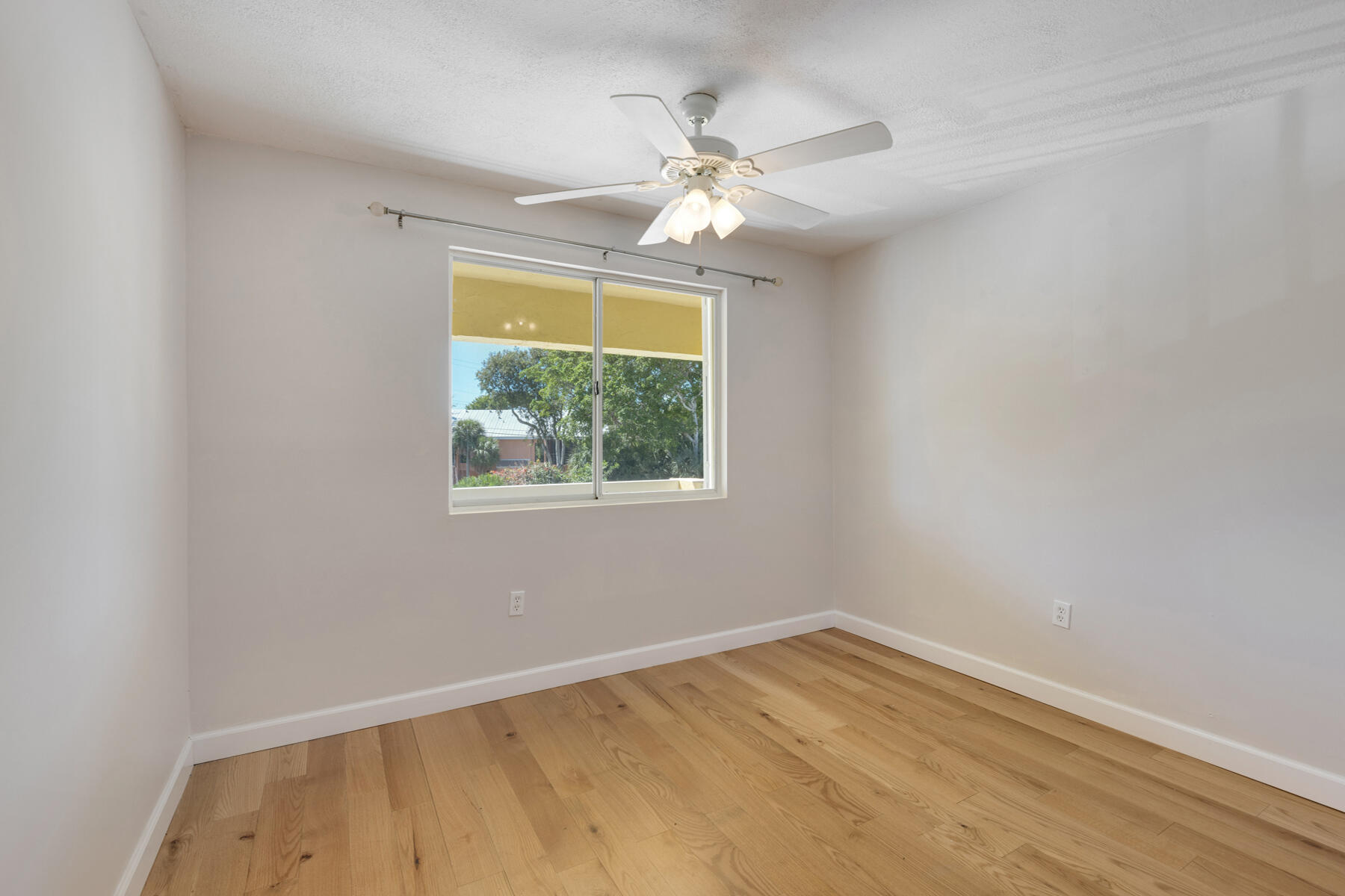 98202 Windward Avenue, Unit CONDO W/ 30 FT BOAT SLIP Key Largo, FL 33037 - Photo 12 of 36 an empty room with a window
