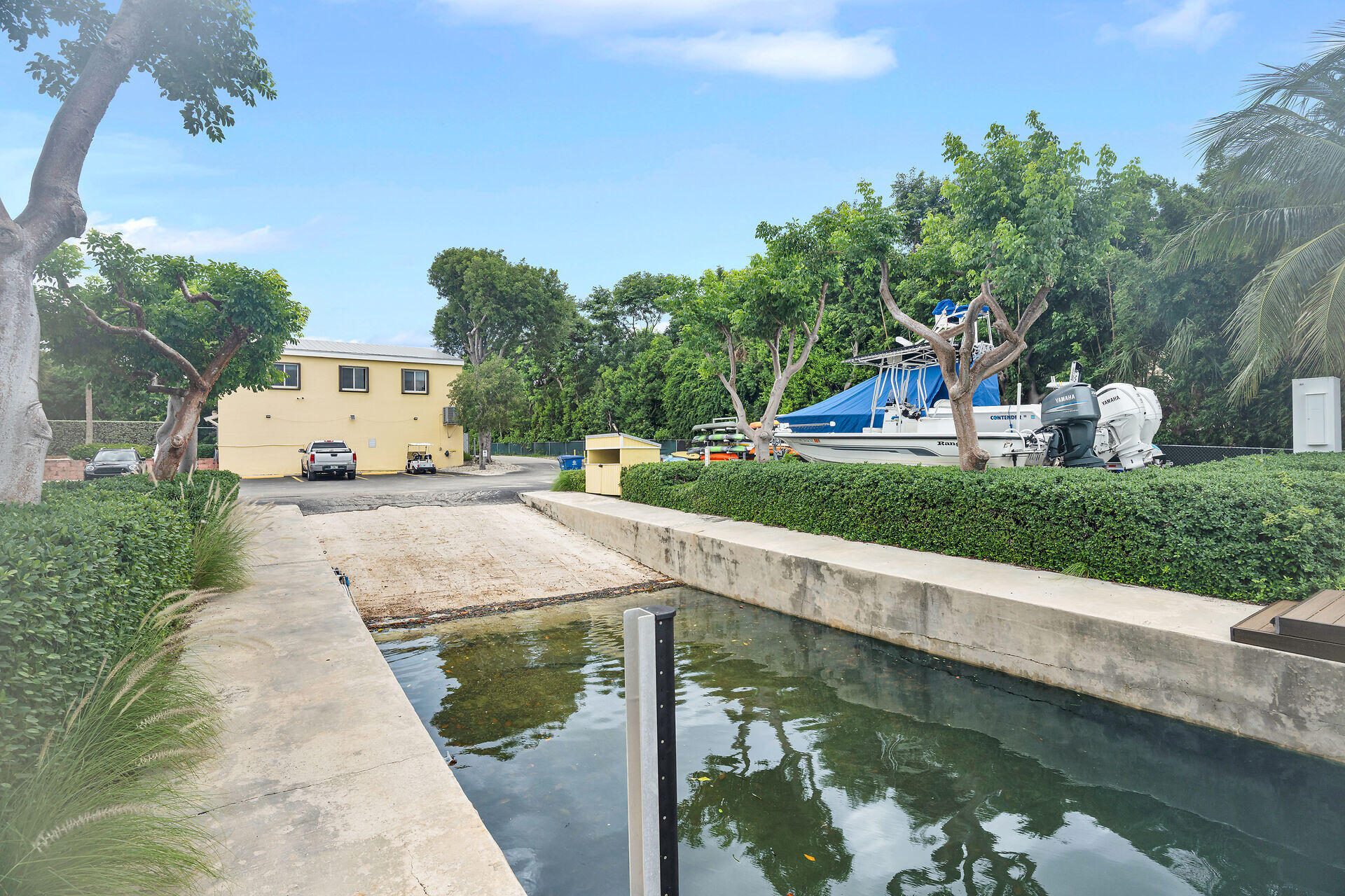 98202 Windward Avenue, Unit CONDO W/ 30 FT BOAT SLIP Key Largo, FL 33037 - Photo 25 of 36 a view of a lake with a house