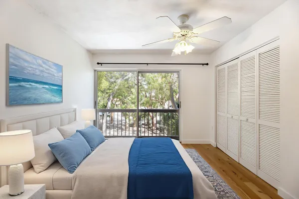 a living room with furniture a rug and a flat screen tv