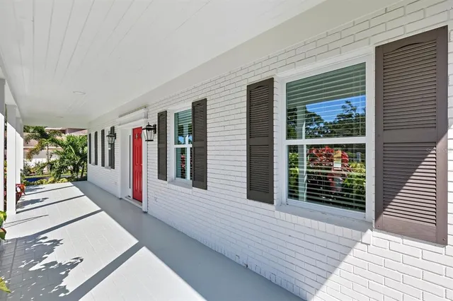 a view of a livingroom with wooden floor and a window