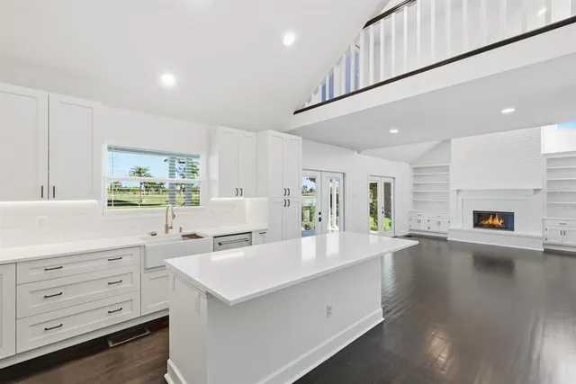 a living room with a bathtub and a window