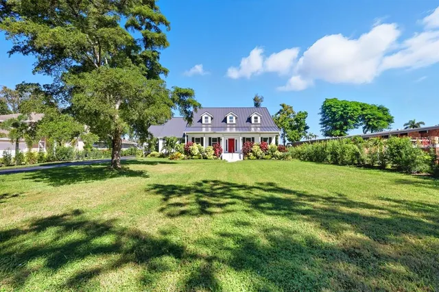 a view of an house with a big yard