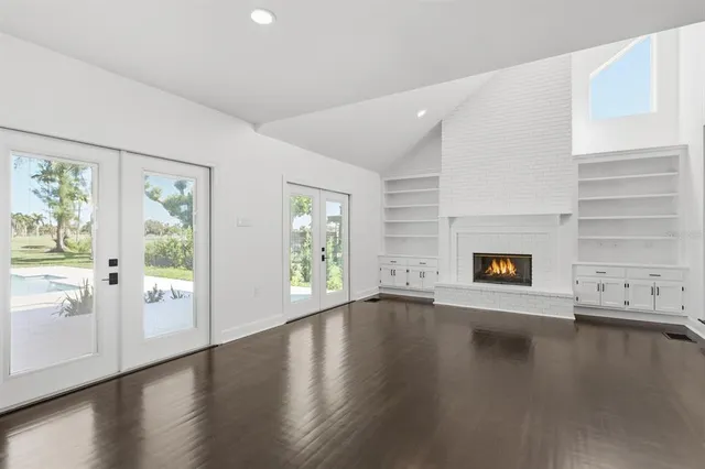 a bathroom with double vanity sinks and a mirror