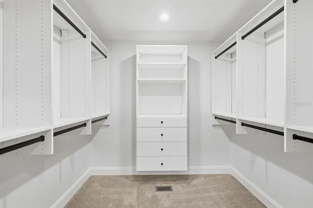 an aerial view of residential houses with city view