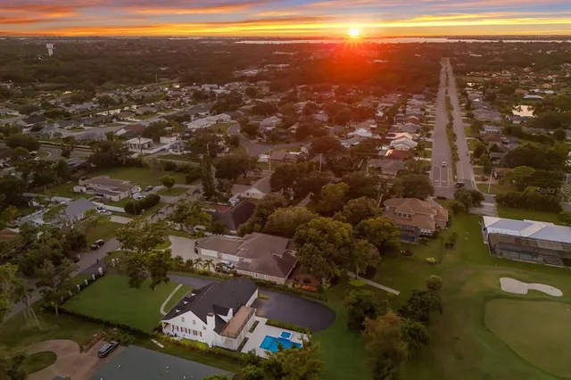 a view of a swimming pool with a yard