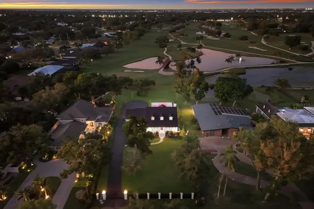 a swimming pool with outdoor seating