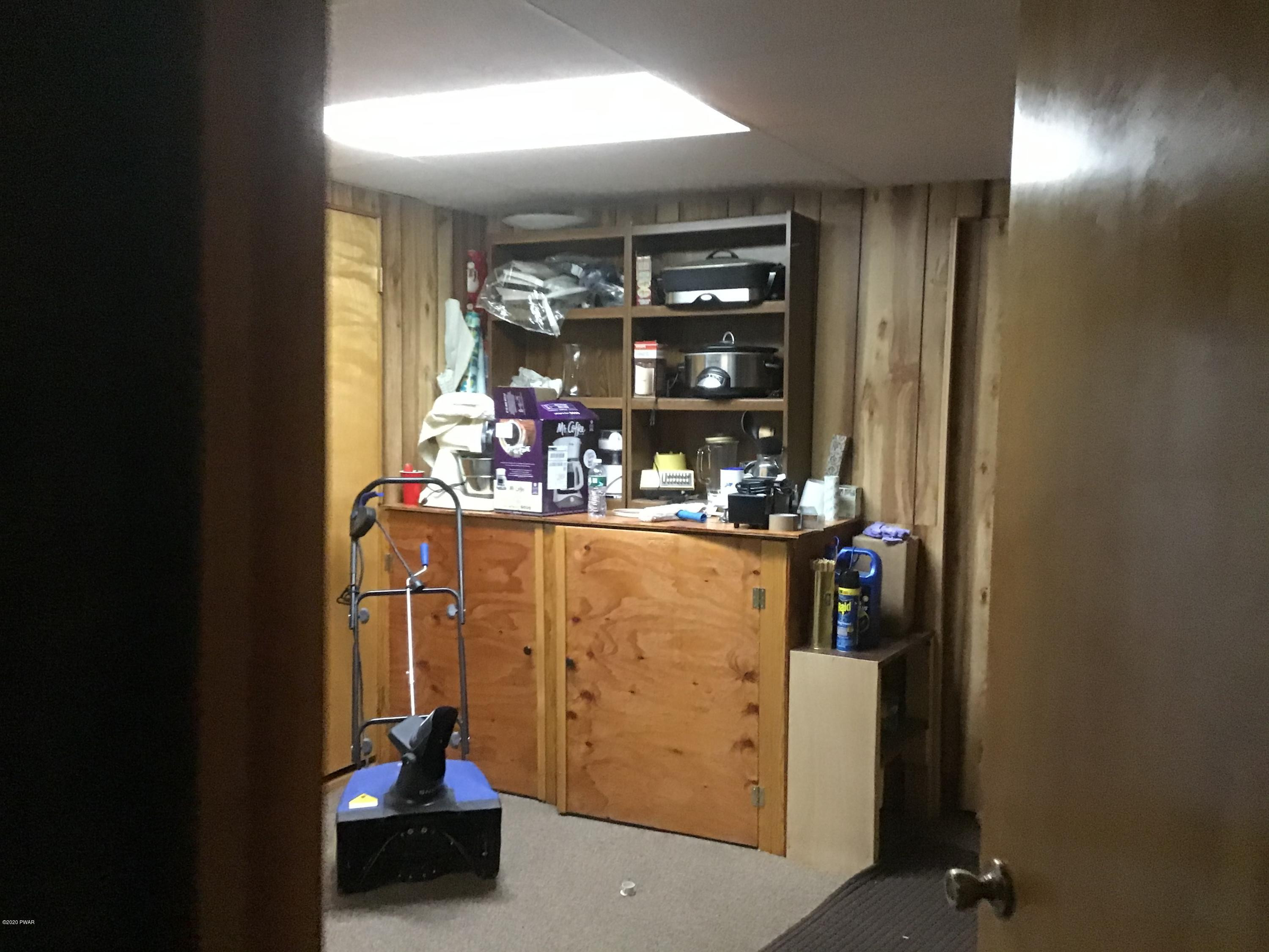 107 Maple Ridge Drive Hawley, PA 18428 - Photo 28 of 32 a room with water heater and a window