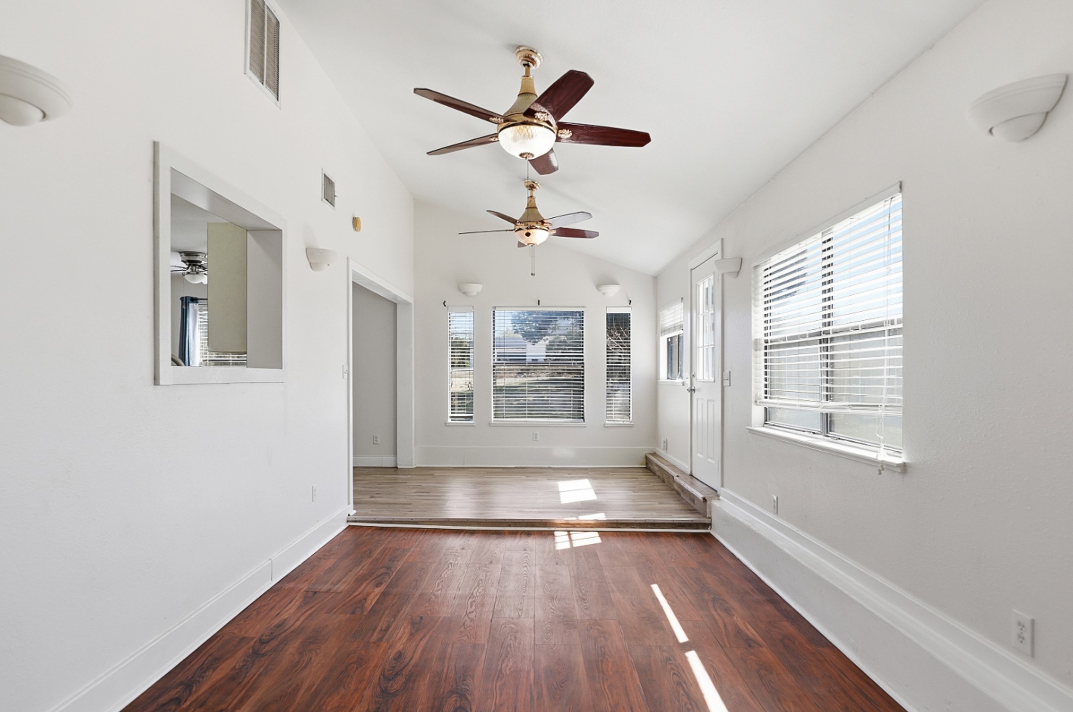 128 Skyview Terrace Leander, TX 78641 - Photo 10 of 23 2nd view. Sunken family room with dark wood-style floors, lofted ceiling, and ceiling fan