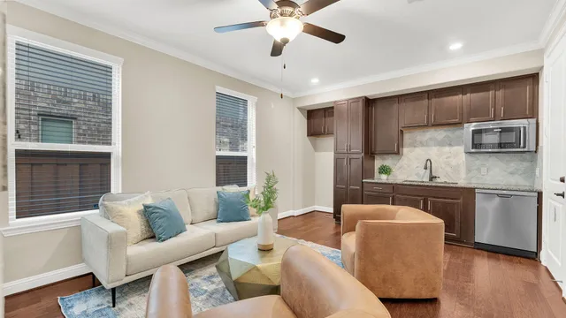 a living room with kitchen island furniture and a window