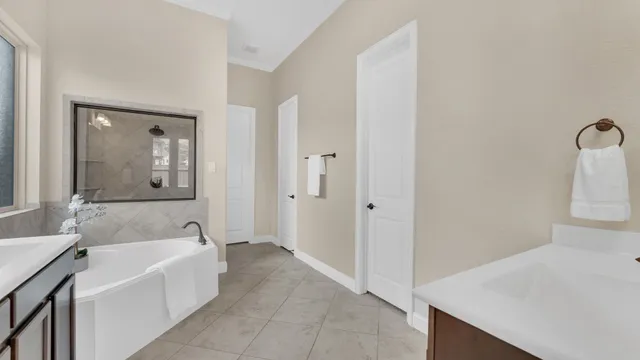 a bathroom with a bathtub and a sink