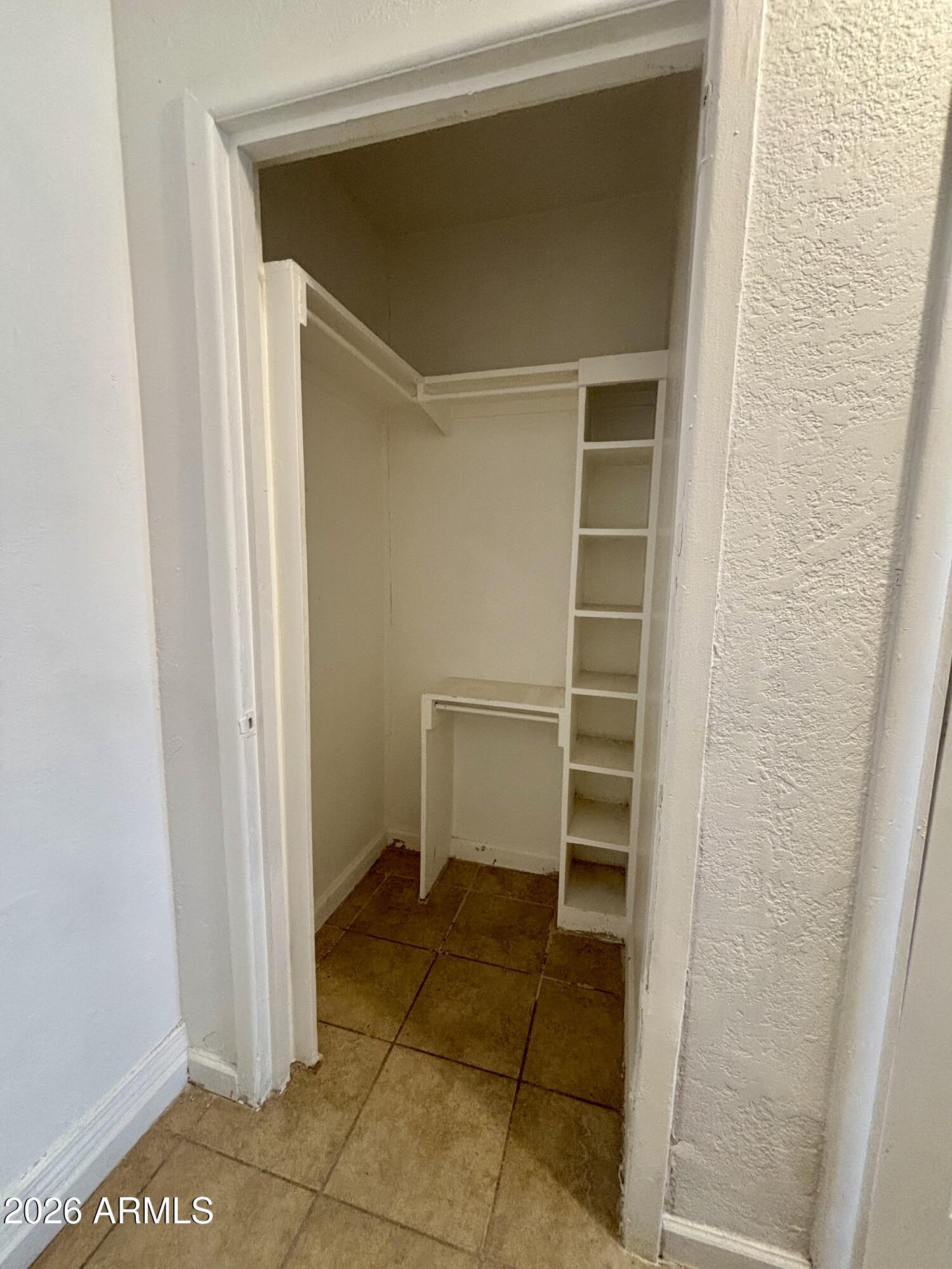 3036 West Almeria Road Phoenix, AZ 85009 - Photo 11 of 20 a view of an empty walk in closet
