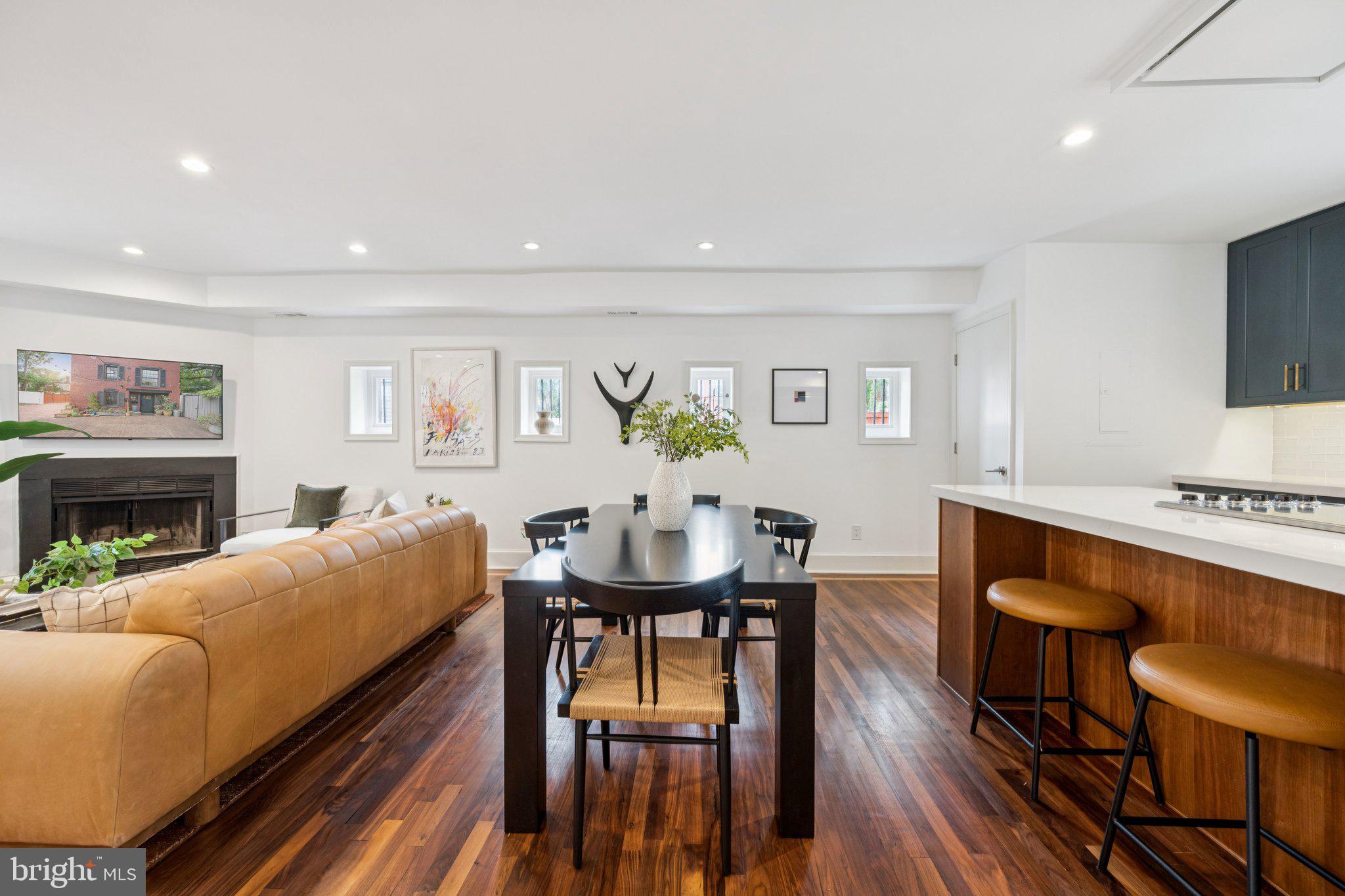 1 Derby Lane Washington, DC 20003 - Photo 11 of 33 a living room with furniture a fireplace and a flat screen tv