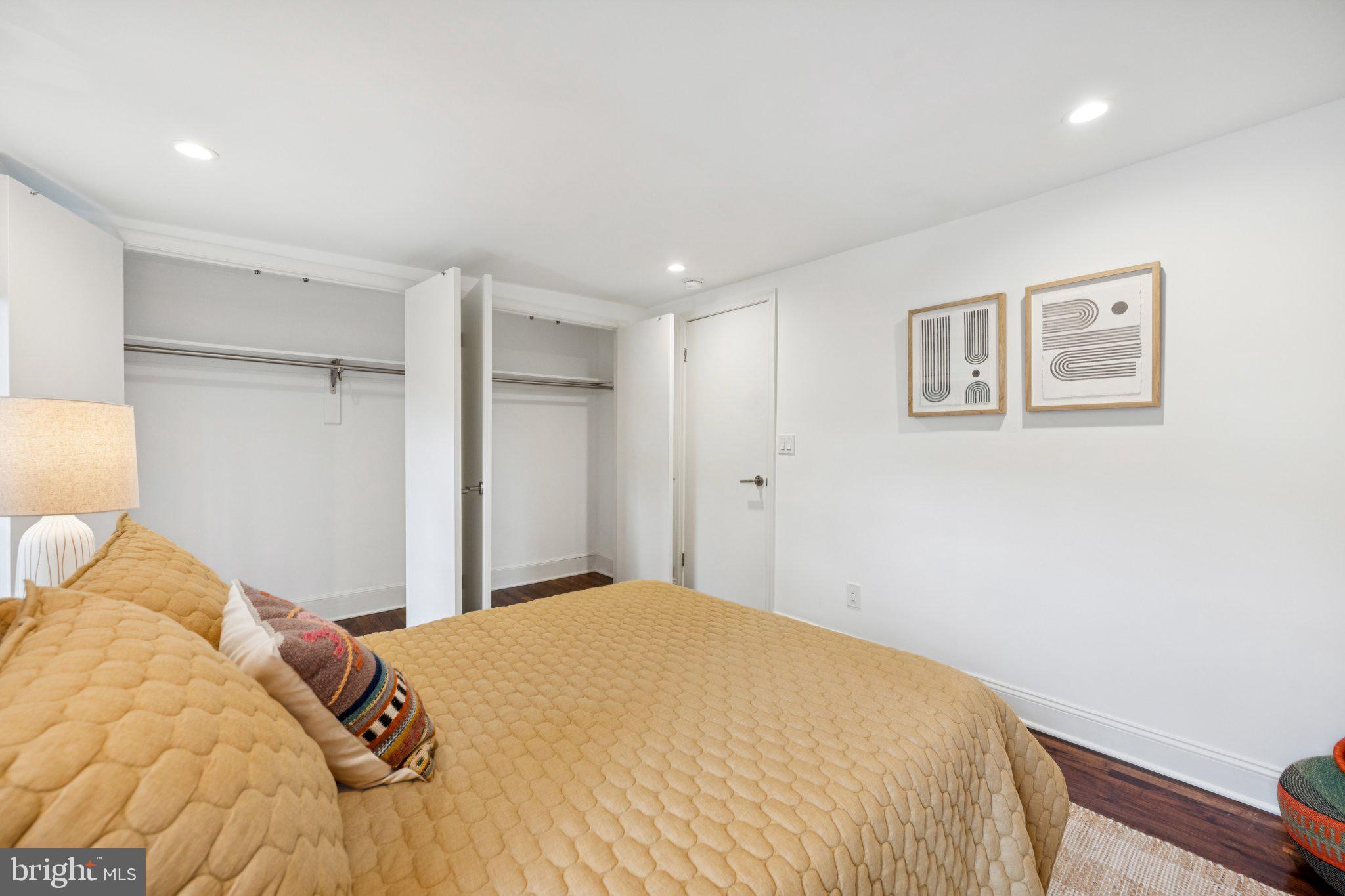 1 Derby Lane Washington, DC 20003 - Photo 23 of 33 a bedroom with a bed and a painting on the wall