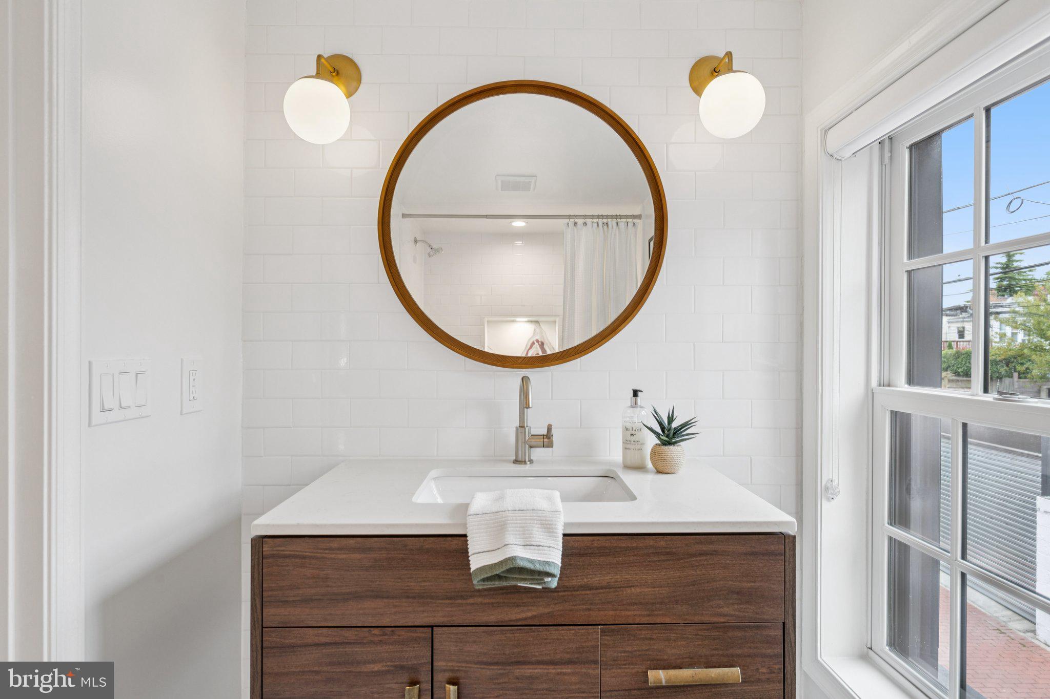 1 Derby Lane Washington, DC 20003 - Photo 26 of 33 a bathroom with a sink and a mirror