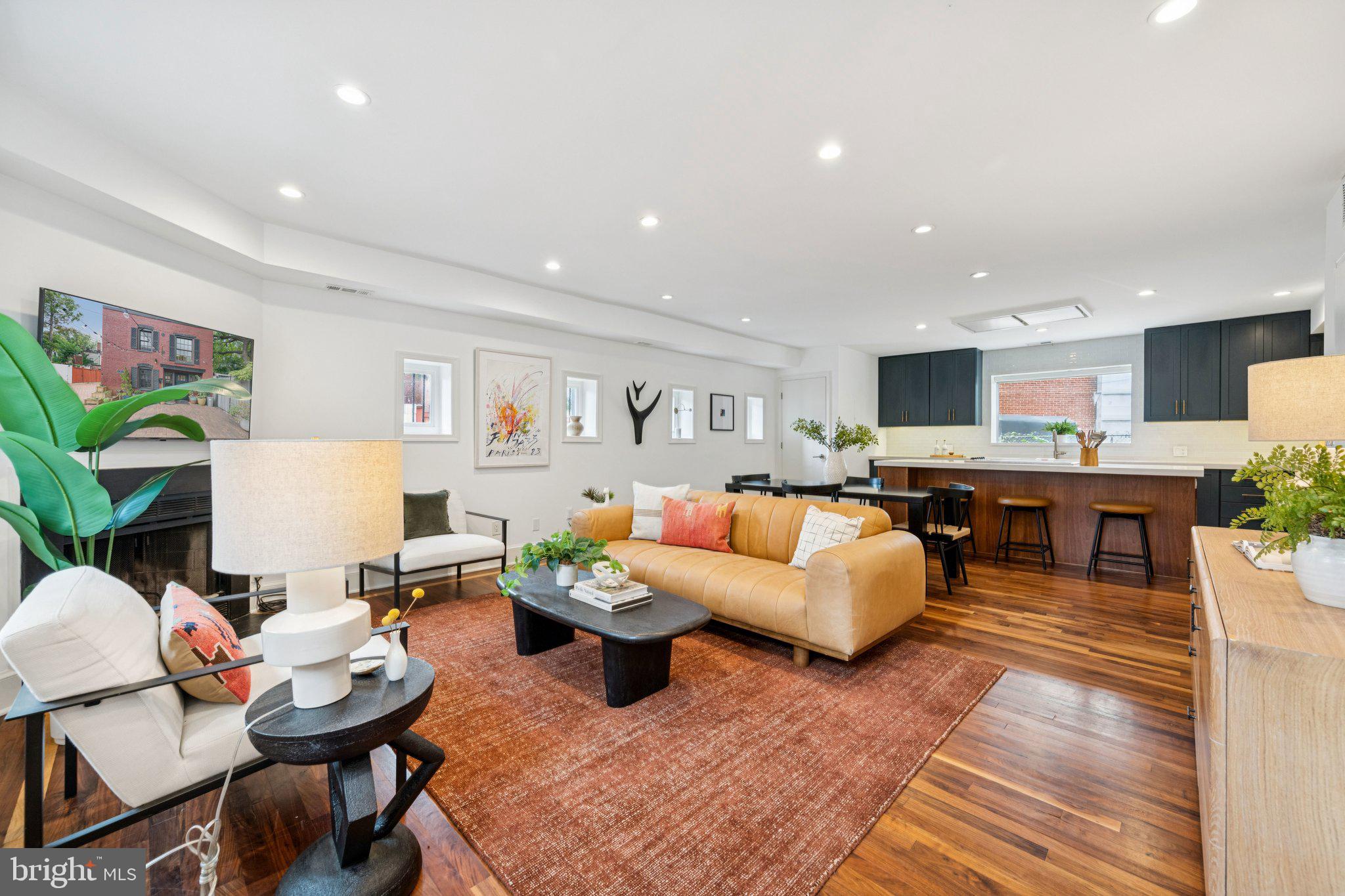 1 Derby Lane Washington, DC 20003 - Photo 4 of 33 a living room with fireplace furniture and a wooden floor