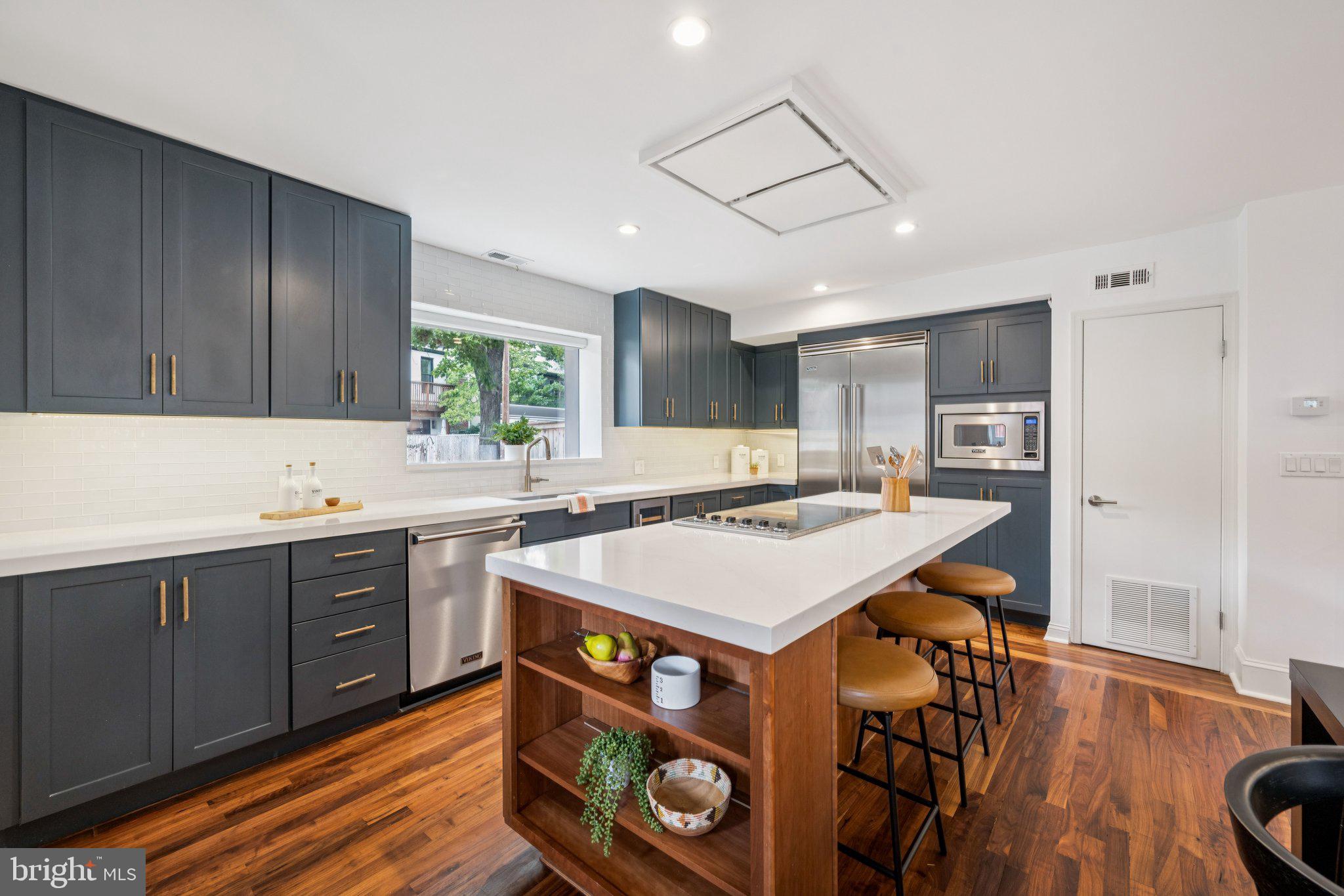 1 Derby Lane Washington, DC 20003 - Photo 9 of 33 a kitchen with a stove a refrigerator and a sink