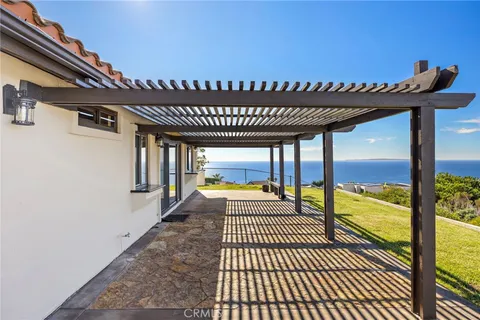 a view of a large swimming pool and outdoor seating