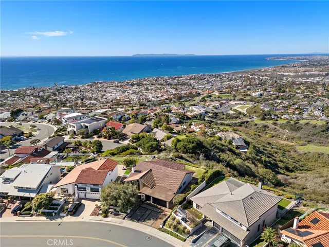 an aerial view of a city with ocean view