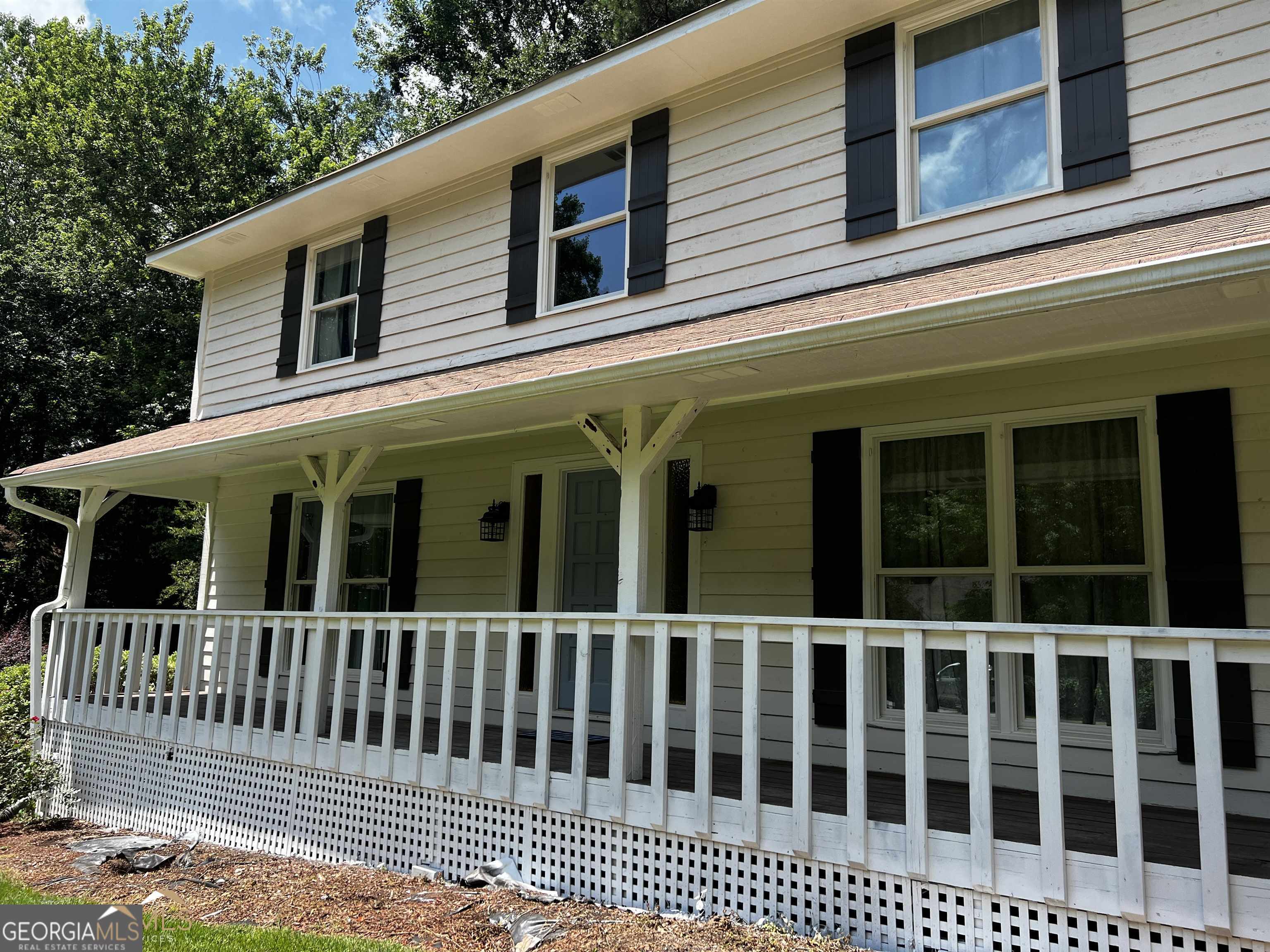 208 Swanson Ridge Peachtree City, GA 30269 - Photo 2 of 40 a view of a brick house with a window