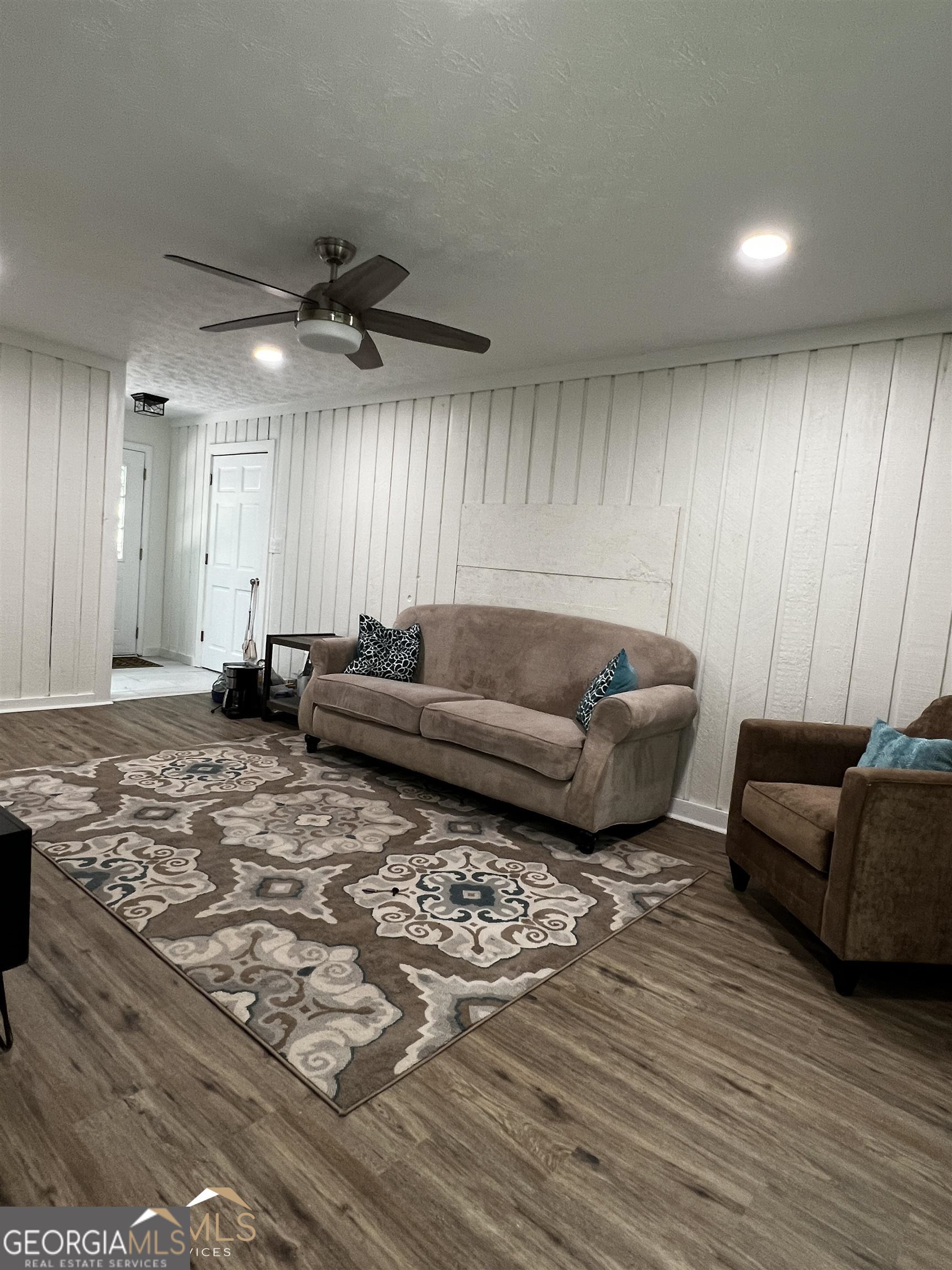 208 Swanson Ridge Peachtree City, GA 30269 - Photo 24 of 40 a living room with furniture and a wooden floor