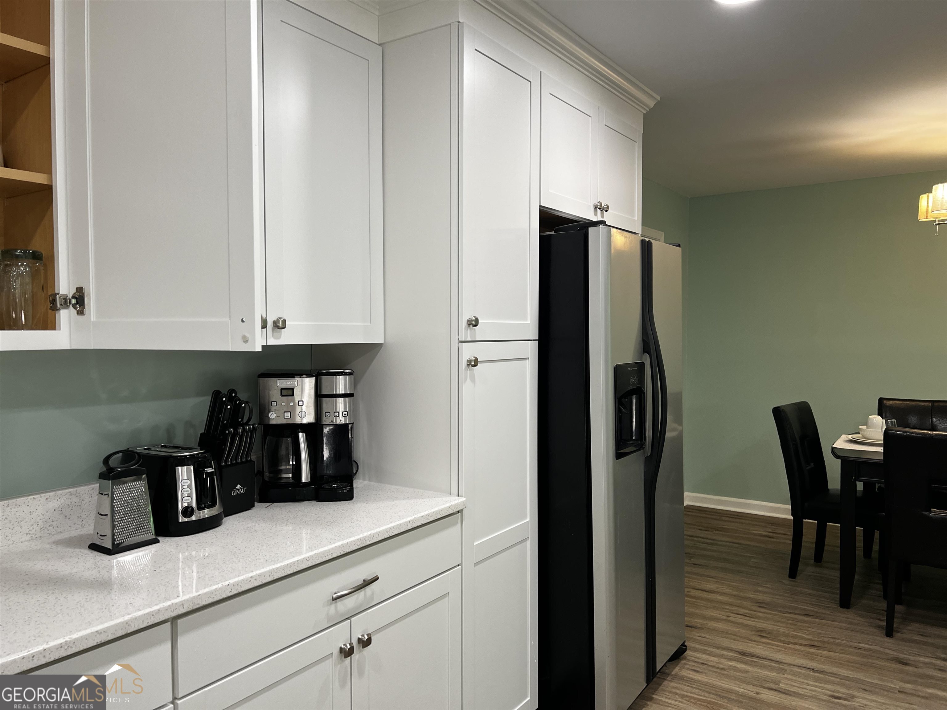208 Swanson Ridge Peachtree City, GA 30269 - Photo 10 of 40 a kitchen with stainless steel appliances a refrigerator and wooden floor