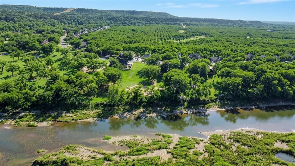 8820 Ravenswood Road Granbury, TX 76049 - Photo 2 of 17 a view of a lake with a mountain