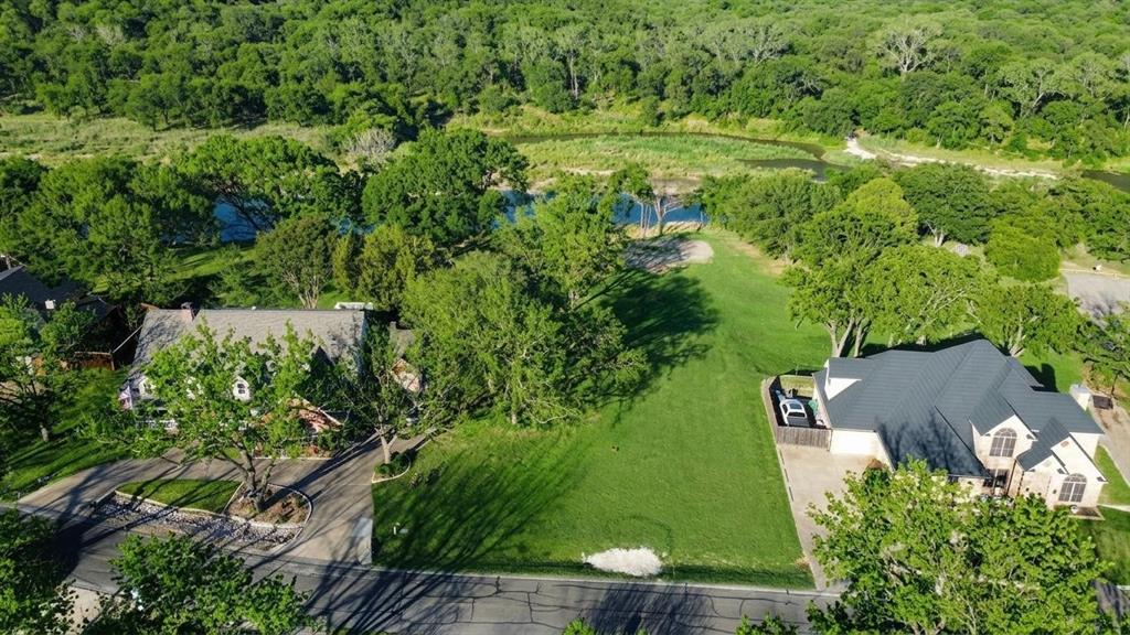 8820 Ravenswood Road Granbury, TX 76049 - Photo 5 of 17 an aerial view of residential house with outdoor space and trees all around