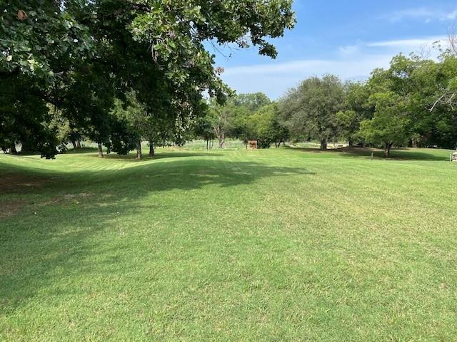 8820 Ravenswood Road Granbury, TX 76049 - Photo 10 of 17 a view of field with trees in the background