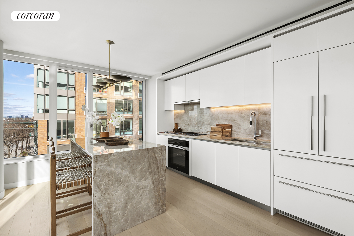 a kitchen with stainless steel appliances and white cabinets