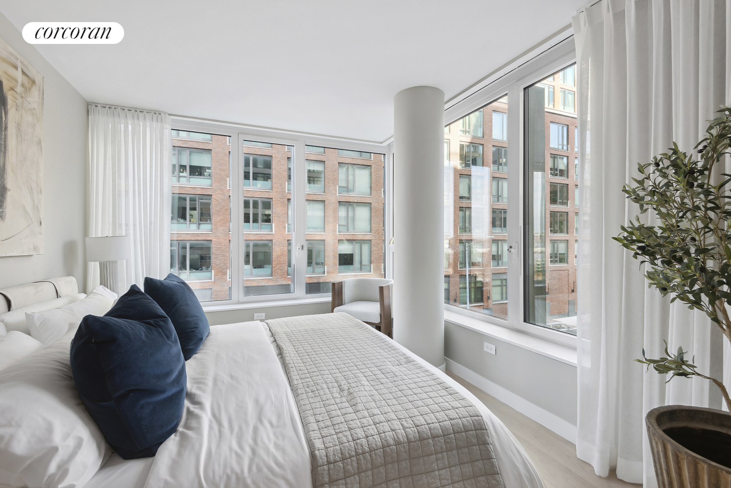 450 Washington Street, Unit 211 Manhattan, NY 10013 - Photo 5 of 21 a spacious bedroom with a bed and a large window