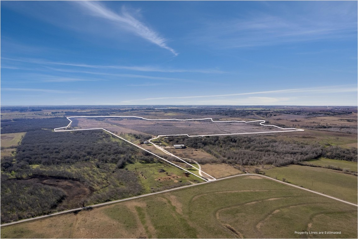 Bird's eye view of the +/- 306 acres facing Southwest.  Downtown Lockhart is 2 miles due South.