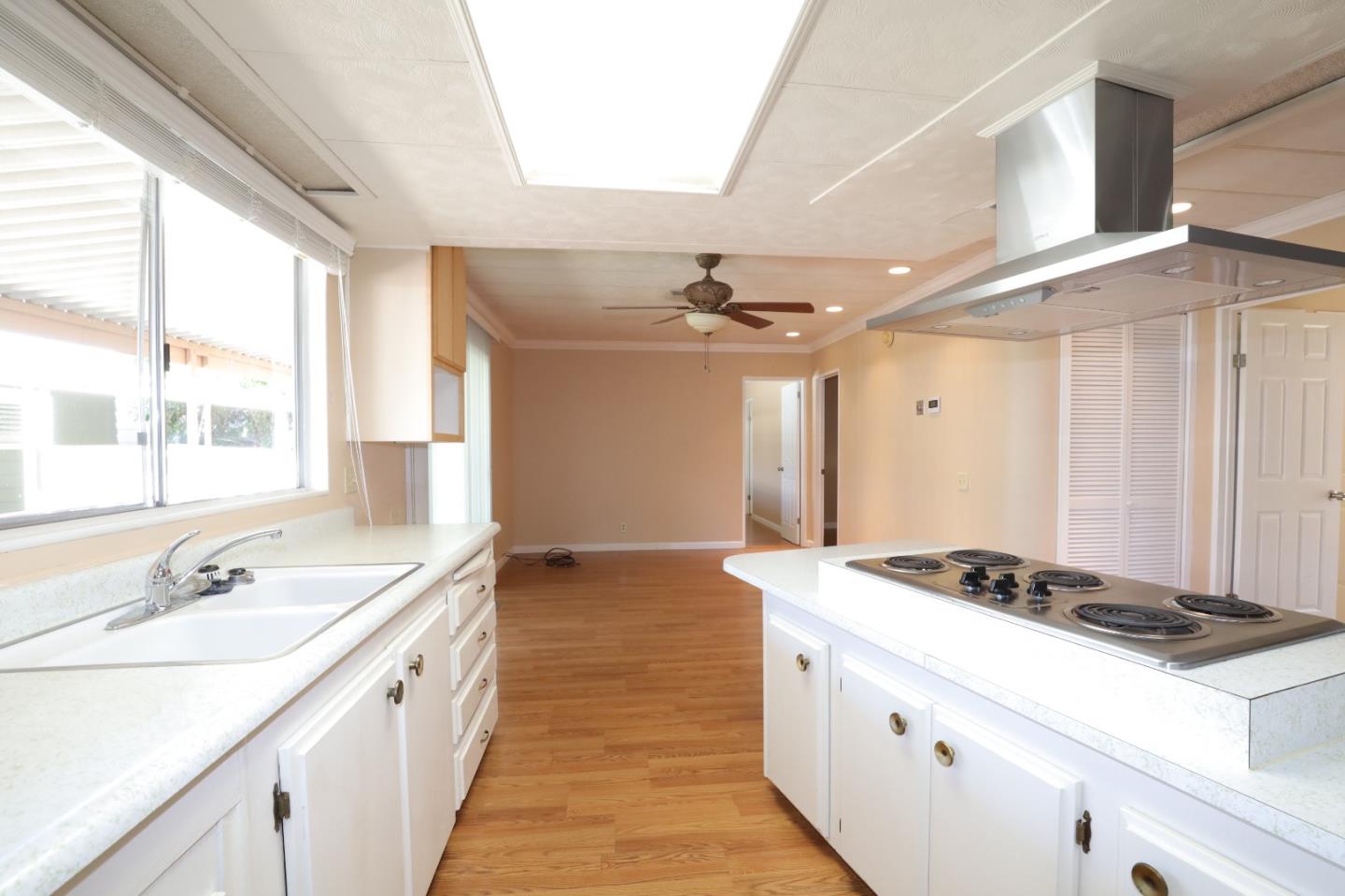 61 Quail Hollow Drive, Unit 61 San Jose, CA 95128 - Photo 11 of 36 a spacious bathroom with a granite countertop sink and a bathtub