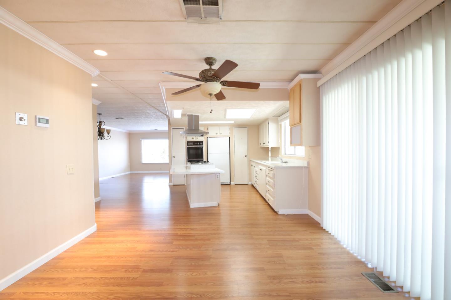 61 Quail Hollow Drive, Unit 61 San Jose, CA 95128 - Photo 15 of 36 a view of empty room with wooden floor and a window