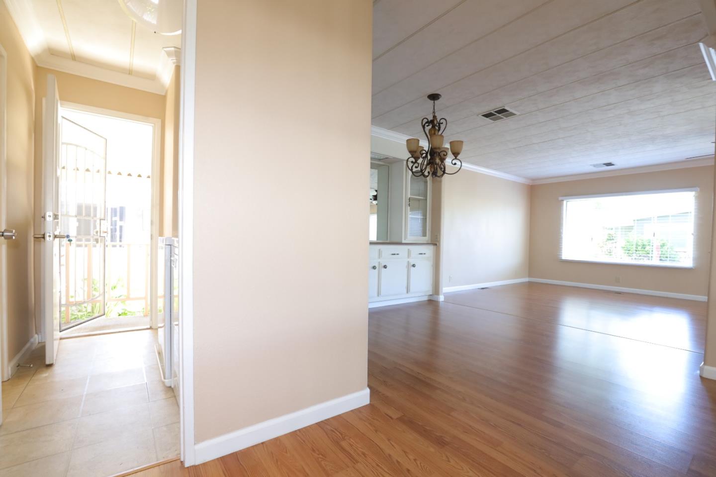 61 Quail Hollow Drive, Unit 61 San Jose, CA 95128 - Photo 16 of 36 wooden floor in an empty room with a window